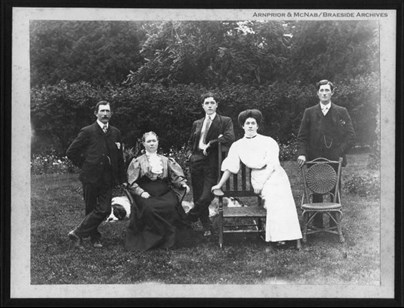 Photograph of the Hornidge family, including Charles Hornidge, Cecilia, their sons Frederick and William, as well as Heter Hornidge in a white dress, who worked as a governess for the Usborne children in the 1880s. The photograph was taken around 1900.